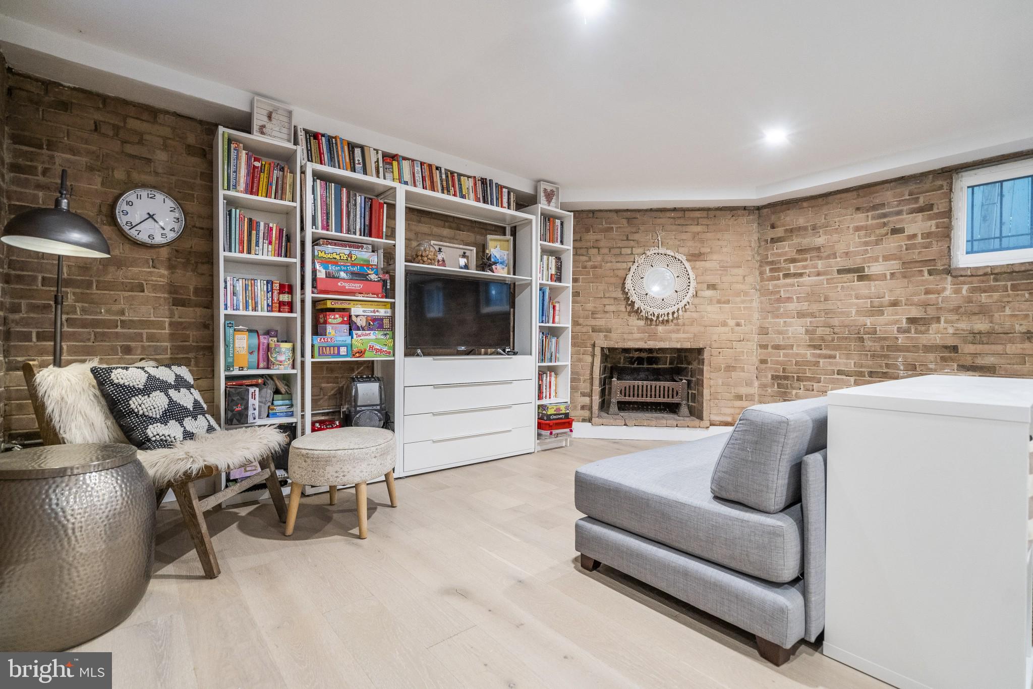 5608 39th Street Northwest Washington, DC 20015 - Photo 30 of 41 Basement family room with wood fireplace