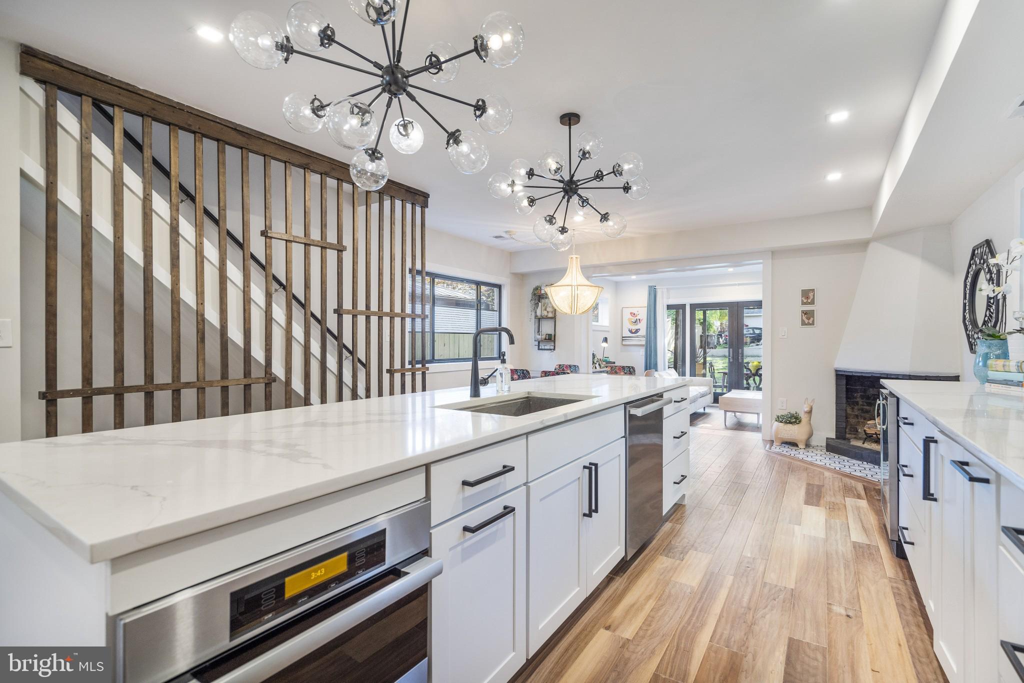 5608 39th Street Northwest Washington, DC 20015 - Photo 7 of 41 Kitchen with immense quartz island and countetops