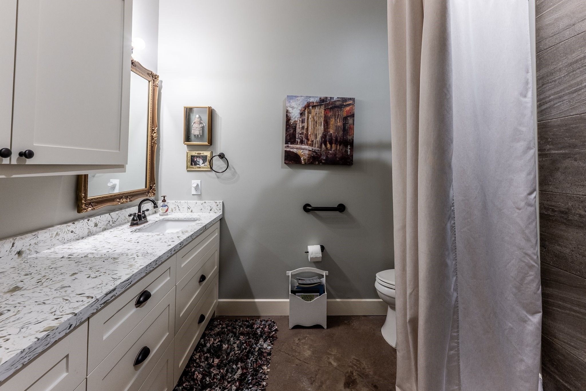 13334 Fultz Road Conroe, TX 77304 - Photo 26 of 49 Thoughtfully designed for comfort and ease, this secondary bath features a granite-topped vanity, custom cabinetry, and a timeless, inviting aesthetic.