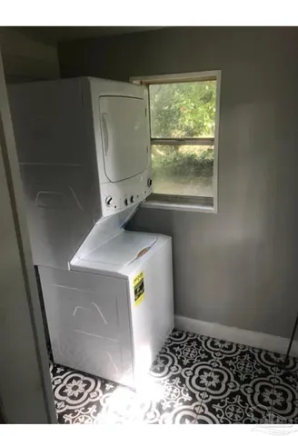 a bathroom with a sink and a window