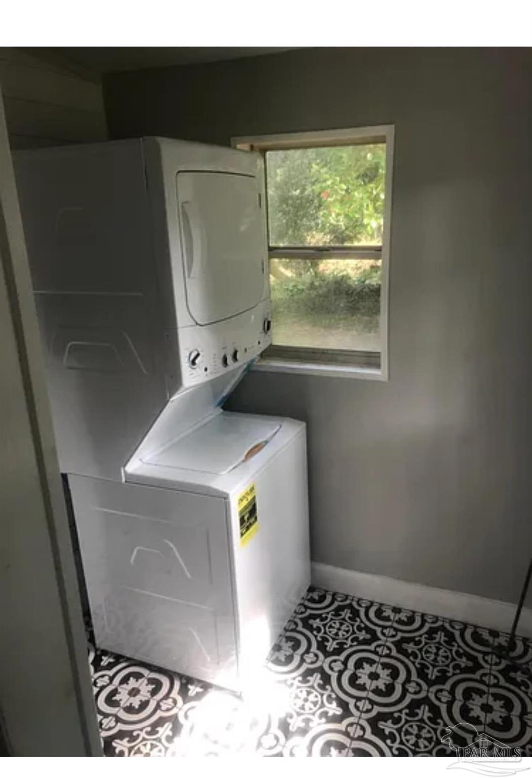 3323 West Cervantes Street Pensacola, FL 32505 - Photo 7 of 12 a bathroom with a sink and a window