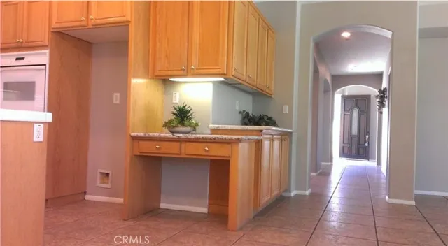 a kitchen with stainless steel appliances a refrigerator and cabinets