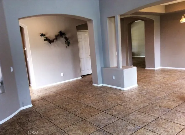 a view of a hallway with closet and front door