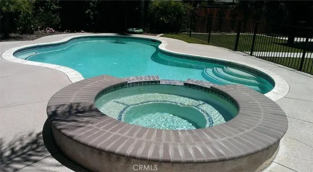 a view of swimming pool from a balcony