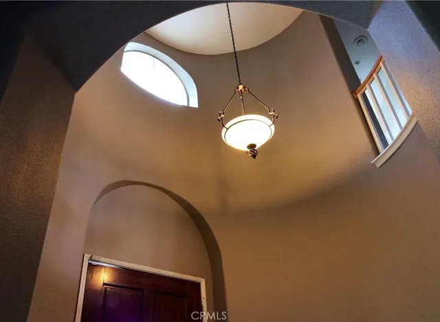 a view of staircase and kitchen view