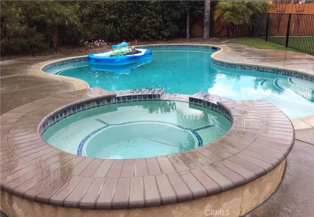 a view of a swimming pool with a outdoor seating