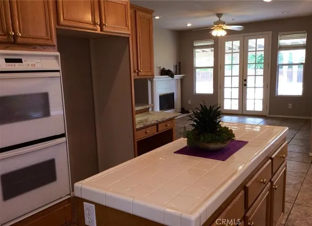 a kitchen with stainless steel appliances a microwave a stove and refrigerator