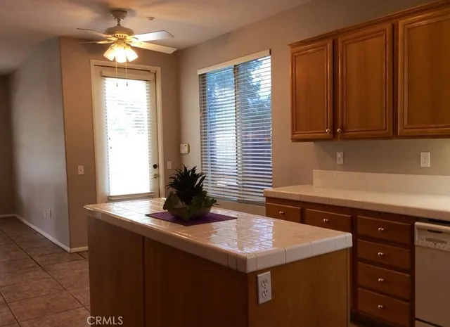 a kitchen with a sink and a window