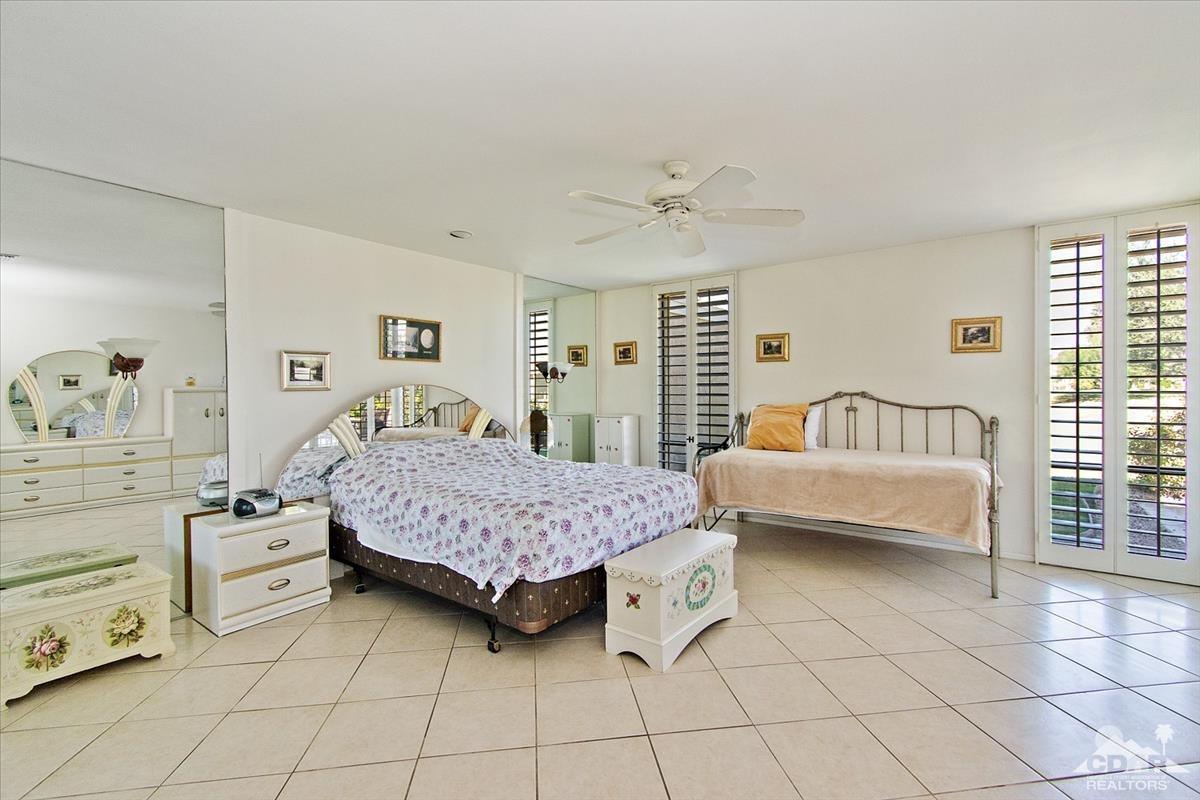 72470 Rodeo Way Rancho Mirage, CA 92270 - Photo 2 of 35 a bedroom with a bed and a couch