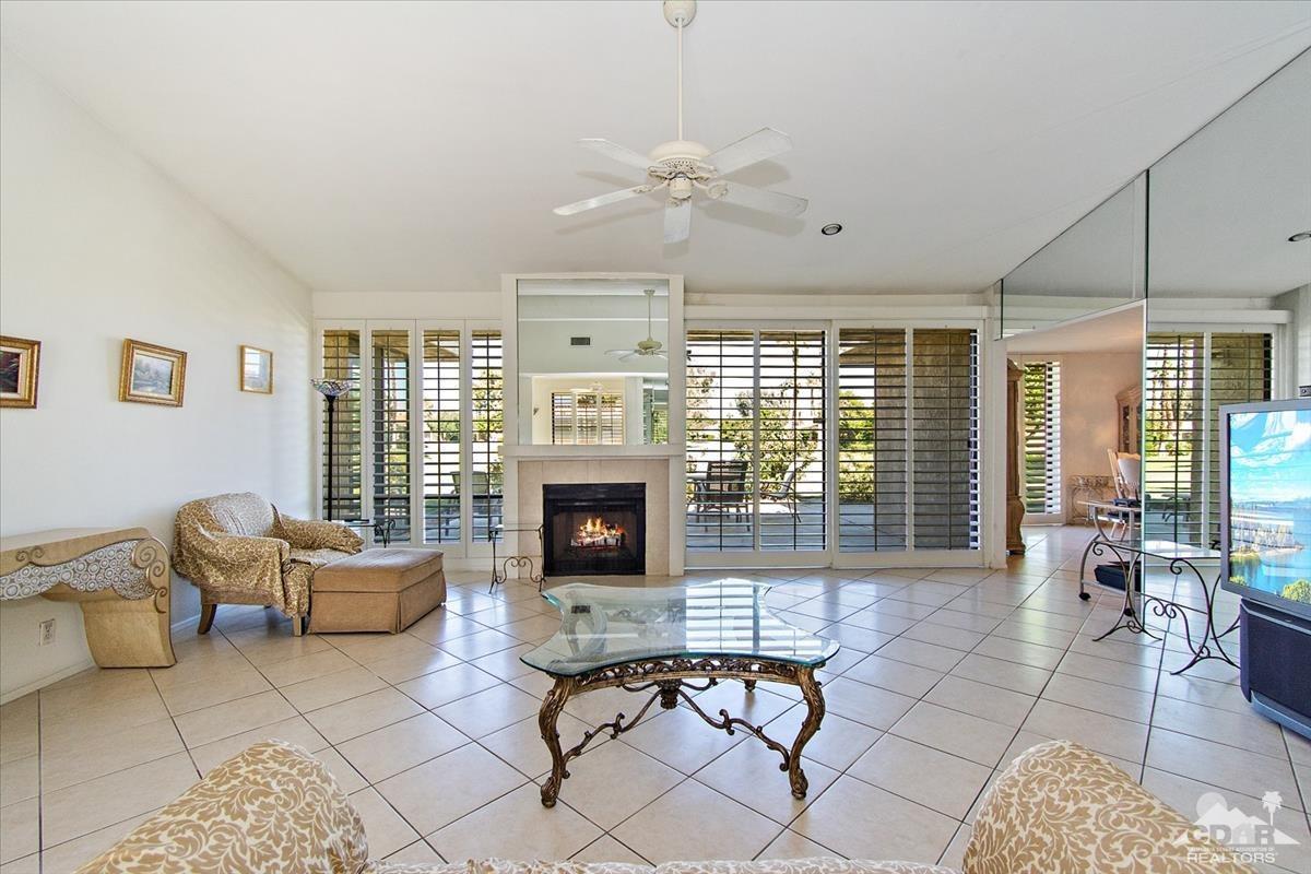 72470 Rodeo Way Rancho Mirage, CA 92270 - Photo 15 of 35 a living room with furniture and a fireplace