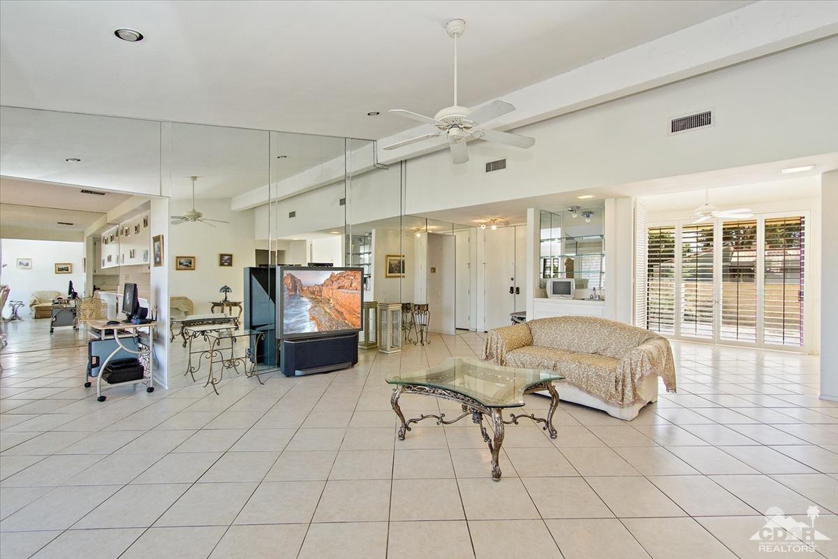 72470 Rodeo Way Rancho Mirage, CA 92270 - Photo 17 of 35 a living room with furniture and a flat screen tv