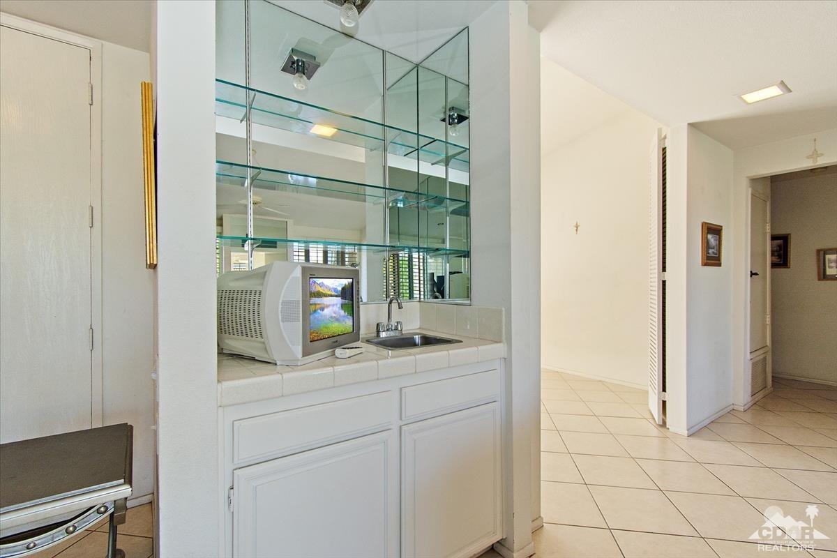 72470 Rodeo Way Rancho Mirage, CA 92270 - Photo 18 of 35 a bathroom with a sink and a mirror
