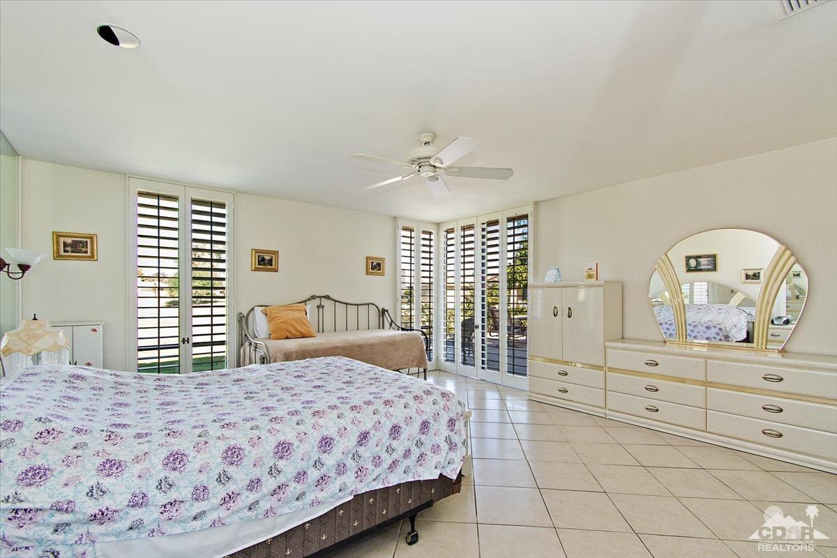 72470 Rodeo Way Rancho Mirage, CA 92270 - Photo 3 of 35 a bedroom with a large bed and a dresser