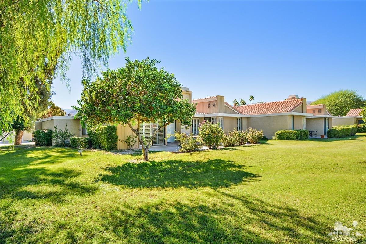 72470 Rodeo Way Rancho Mirage, CA 92270 - Photo 24 of 35 a front view of a house with a yard