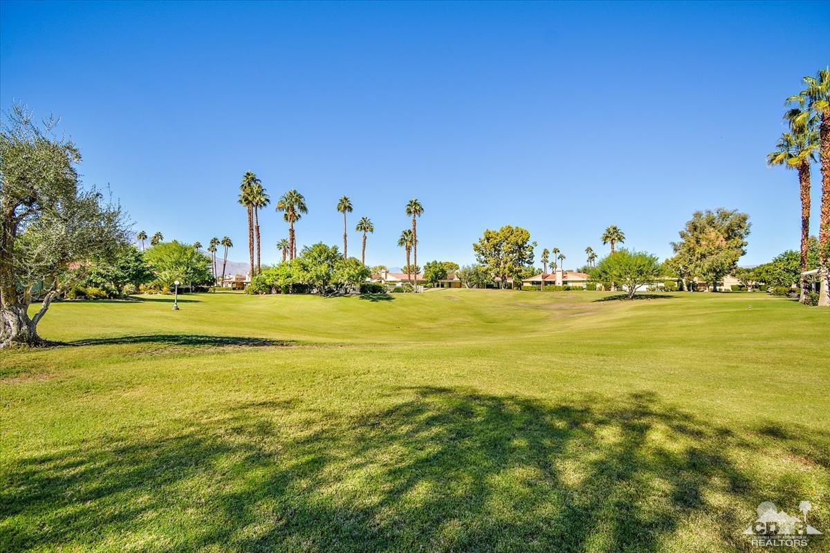 72470 Rodeo Way Rancho Mirage, CA 92270 - Photo 25 of 35 a view of an ocean with a building in the background
