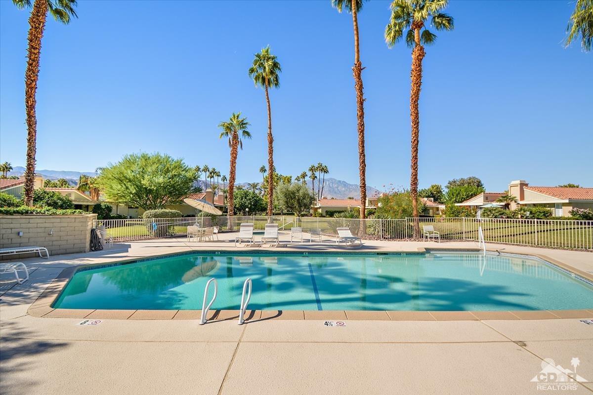 72470 Rodeo Way Rancho Mirage, CA 92270 - Photo 27 of 35 a view of a swimming pool and a chairs