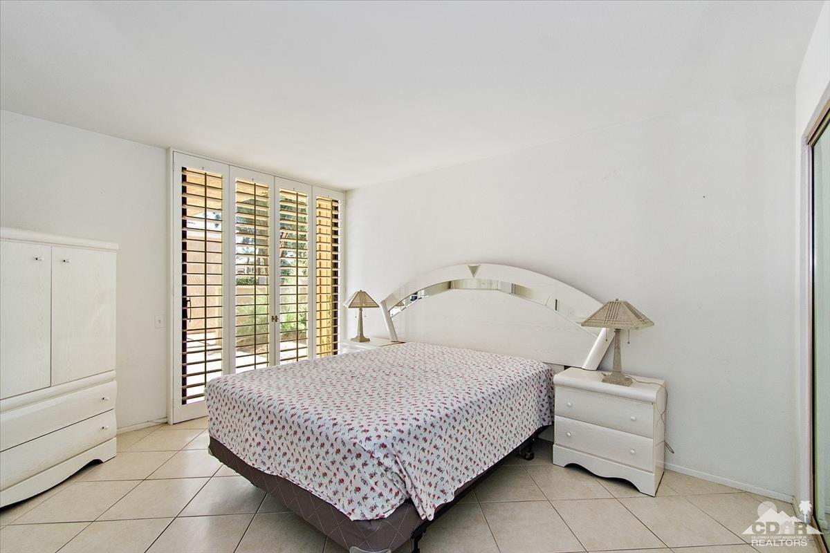 72470 Rodeo Way Rancho Mirage, CA 92270 - Photo 6 of 35 a bedroom with a bed and a window