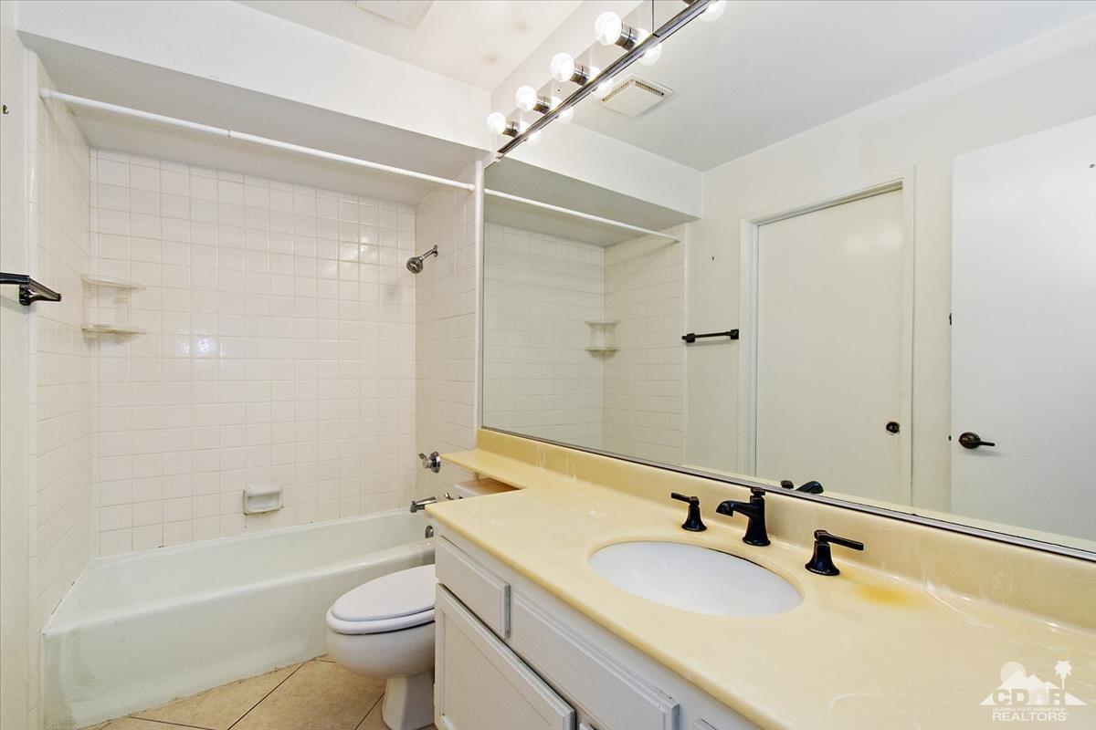 72470 Rodeo Way Rancho Mirage, CA 92270 - Photo 7 of 35 a bathroom with a sink a toilet and shower