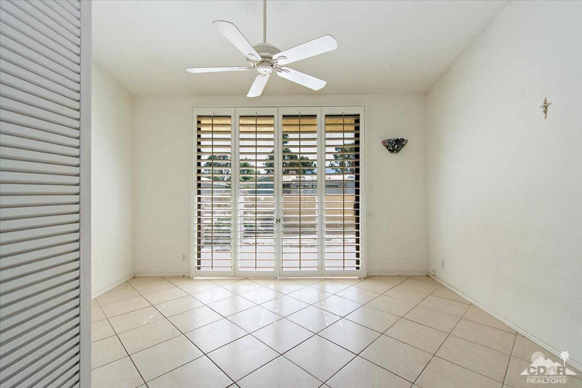 72470 Rodeo Way Rancho Mirage, CA 92270 - Photo 8 of 35 an empty room with windows and fan