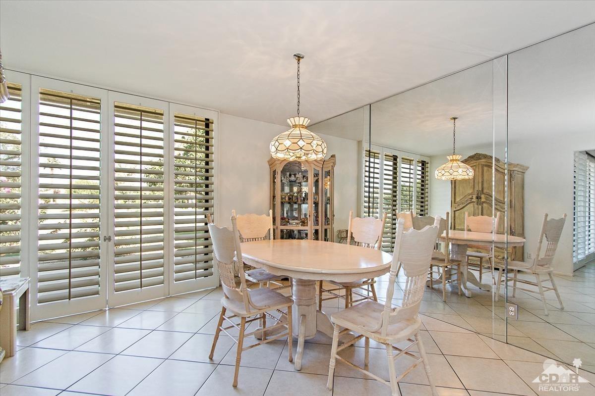 72470 Rodeo Way Rancho Mirage, CA 92270 - Photo 9 of 35 a dining room with furniture and window