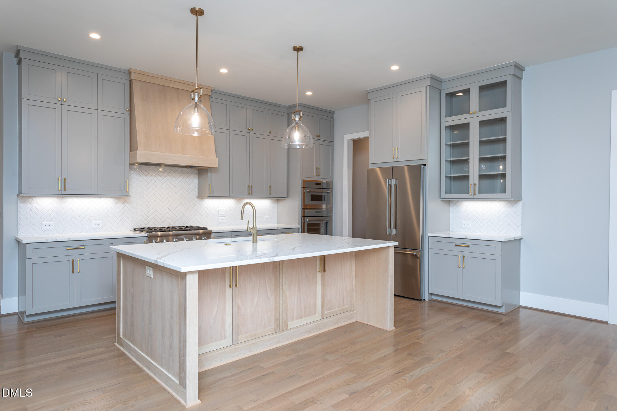 4138 Laurel Hills Road Raleigh, NC 27612 - Photo 17 of 20 a kitchen with a white stove refrigerator and cabinets