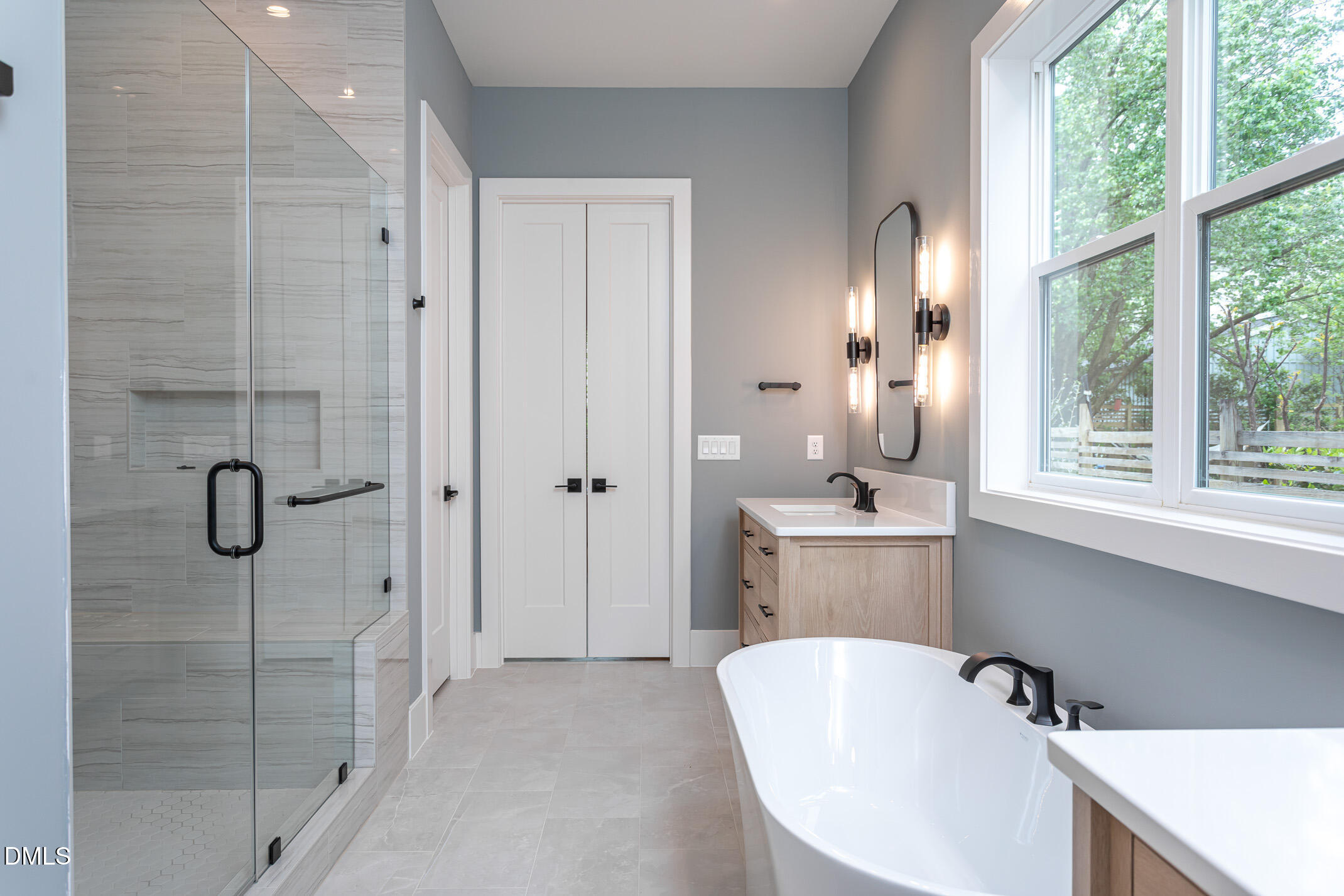 4138 Laurel Hills Road Raleigh, NC 27612 - Photo 19 of 20 a bathroom with a tub sink and mirror