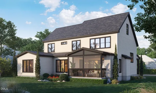 a front view of a house with a garden and plants