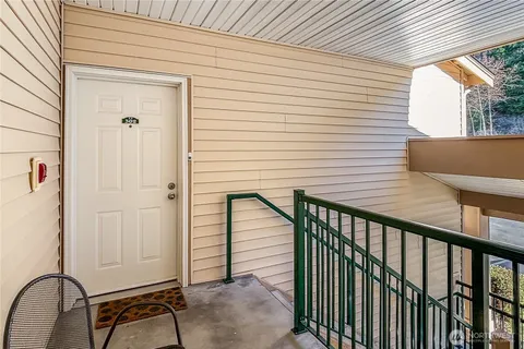 a view of a balcony with furniture