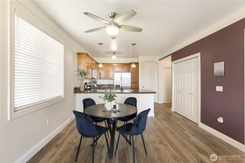 a view of a dining room with furniture window and wooden floor