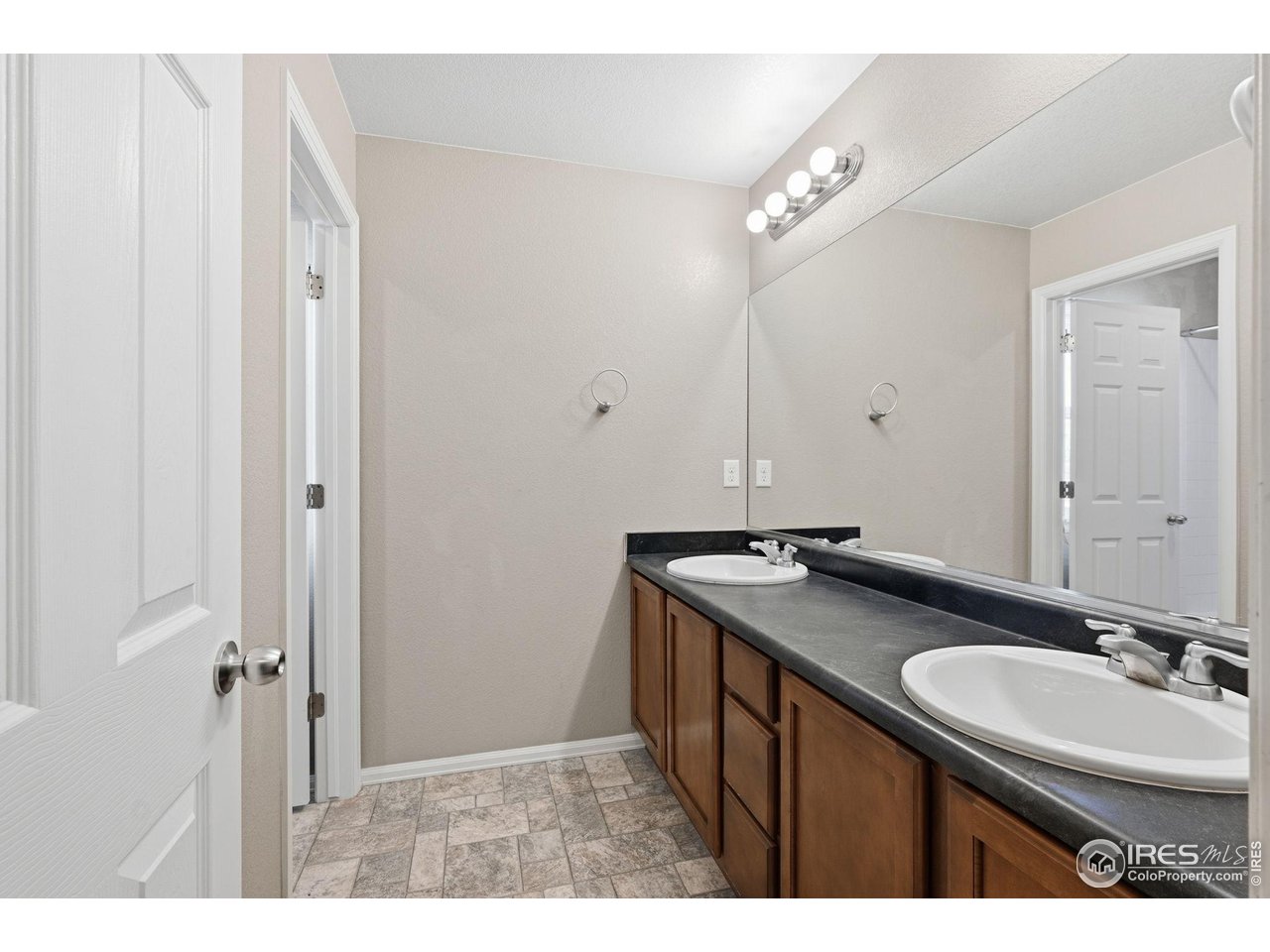 1555 Benfleet Court Windsor, CO 80550 - Photo 26 of 41 Upstairs full bath with dual sinks