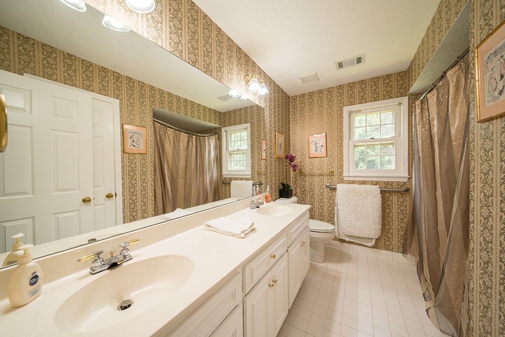 8100 Warm Springs Road Midland, GA 31820 - Photo 23 of 35 a spacious bathroom with a double vanity sink a mirror and a shower