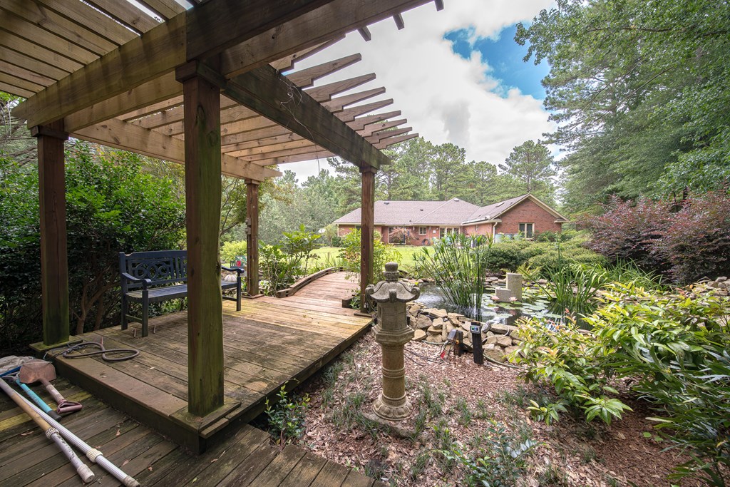 8100 Warm Springs Road Midland, GA 31820 - Photo 31 of 35 a view of a patio with table and chairs next to a yard