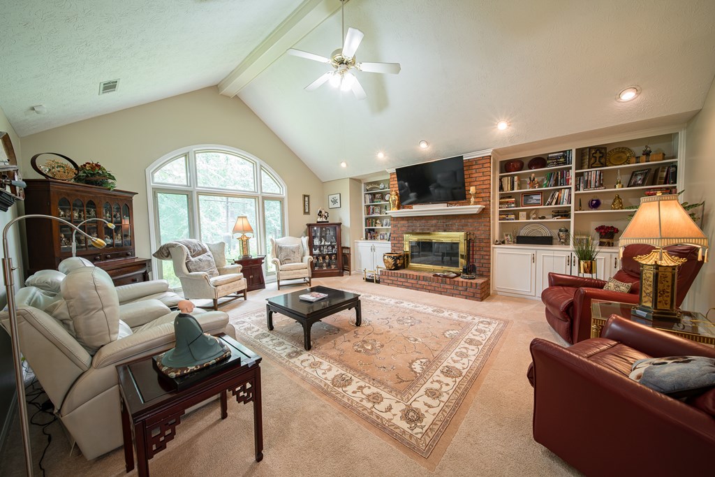 8100 Warm Springs Road Midland, GA 31820 - Photo 4 of 35 a living room with furniture fireplace and a large window