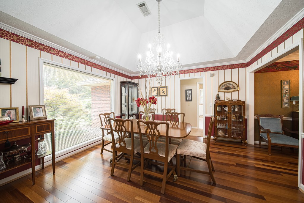 8100 Warm Springs Road Midland, GA 31820 - Photo 8 of 35 a view of a dining room with furniture window and wooden floor