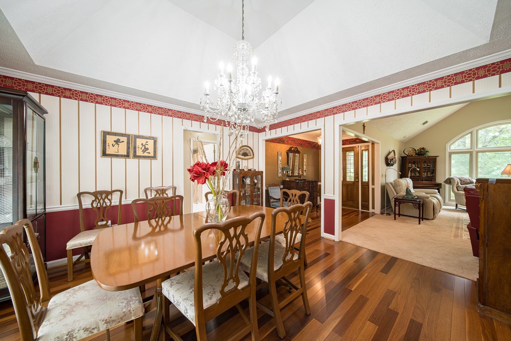 8100 Warm Springs Road Midland, GA 31820 - Photo 9 of 35 a living room with furniture and a chandelier