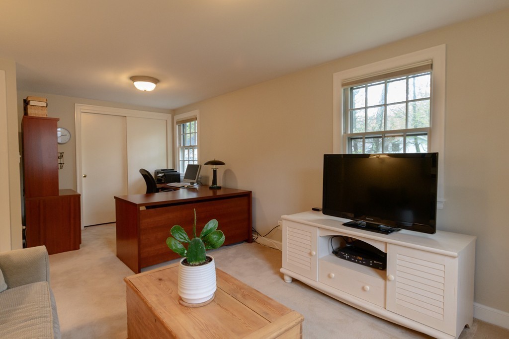 18 Haven Road Wellesley, MA 02481 - Photo 12 of 16 a living room with furniture and a flat screen tv