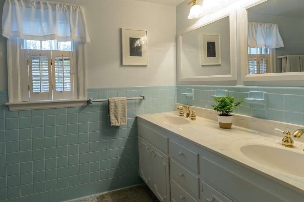 18 Haven Road Wellesley, MA 02481 - Photo 13 of 16 a bathroom with a granite countertop sink and a mirror
