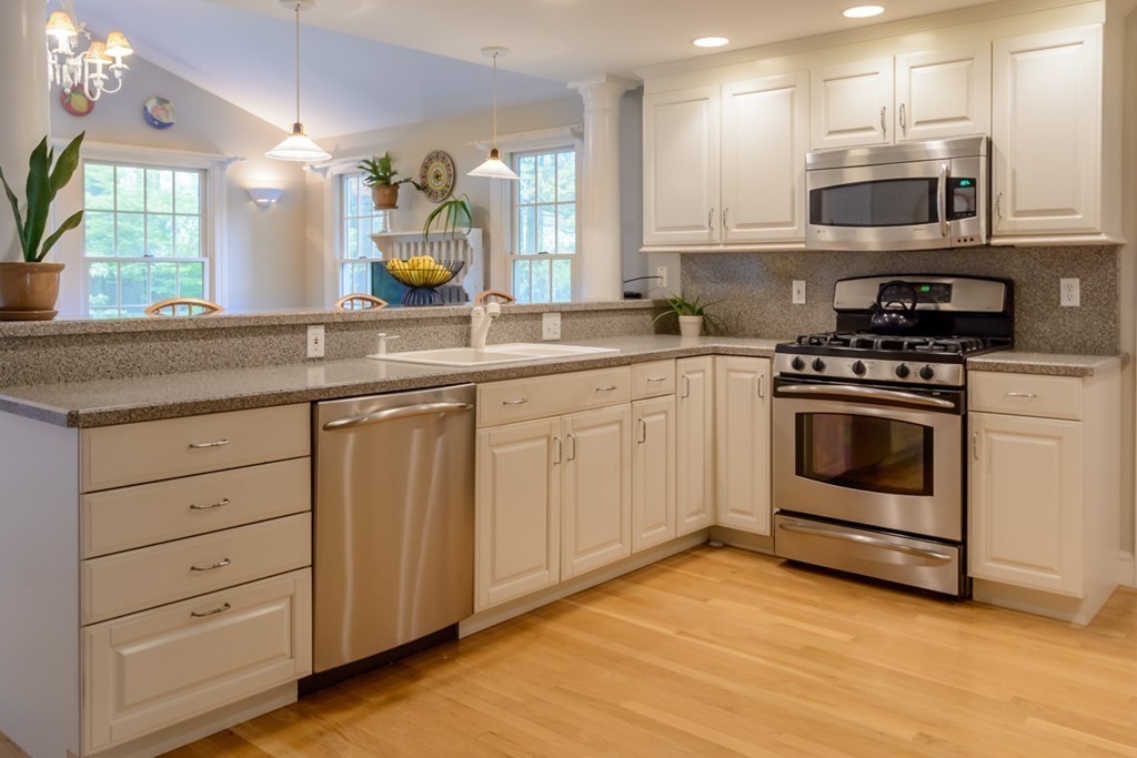 18 Haven Road Wellesley, MA 02481 - Photo 4 of 16 a kitchen with stainless steel appliances granite countertop a stove and a sink