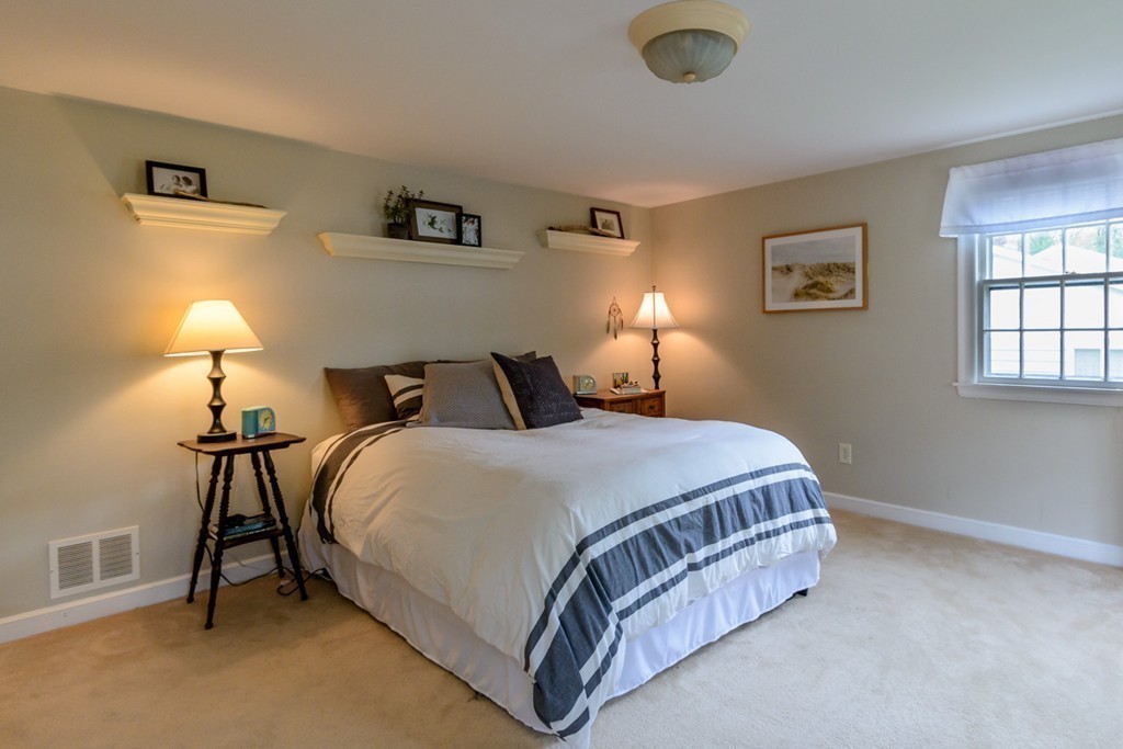 18 Haven Road Wellesley, MA 02481 - Photo 10 of 16 a bedroom with a bed and a lamp