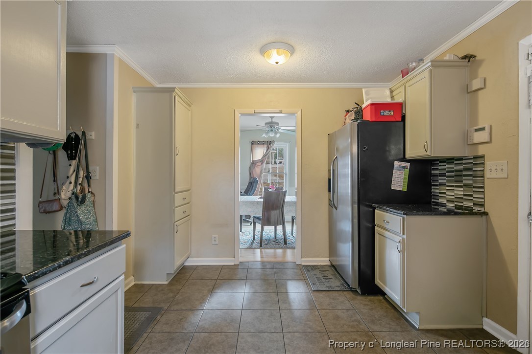 6432 Milford Road Fayetteville, NC 28303 - Photo 19 of 50 a kitchen with stainless steel appliances granite countertop a refrigerator and a sink