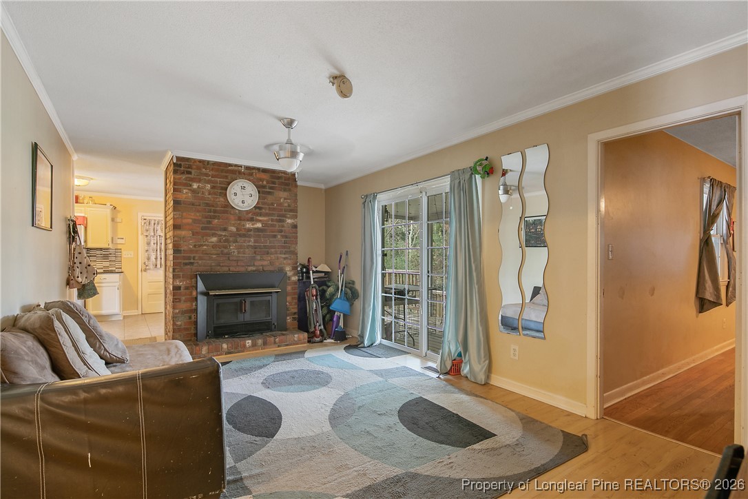 6432 Milford Road Fayetteville, NC 28303 - Photo 25 of 50 a living room with furniture and a fireplace