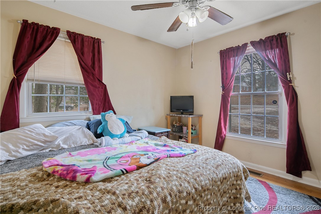 6432 Milford Road Fayetteville, NC 28303 - Photo 33 of 50 a bedroom with a bed and a window