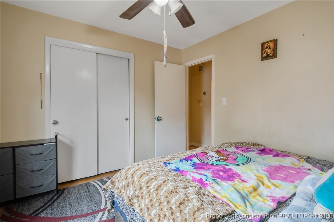 6432 Milford Road Fayetteville, NC 28303 - Photo 34 of 50 a bedroom with a bed and a dresser