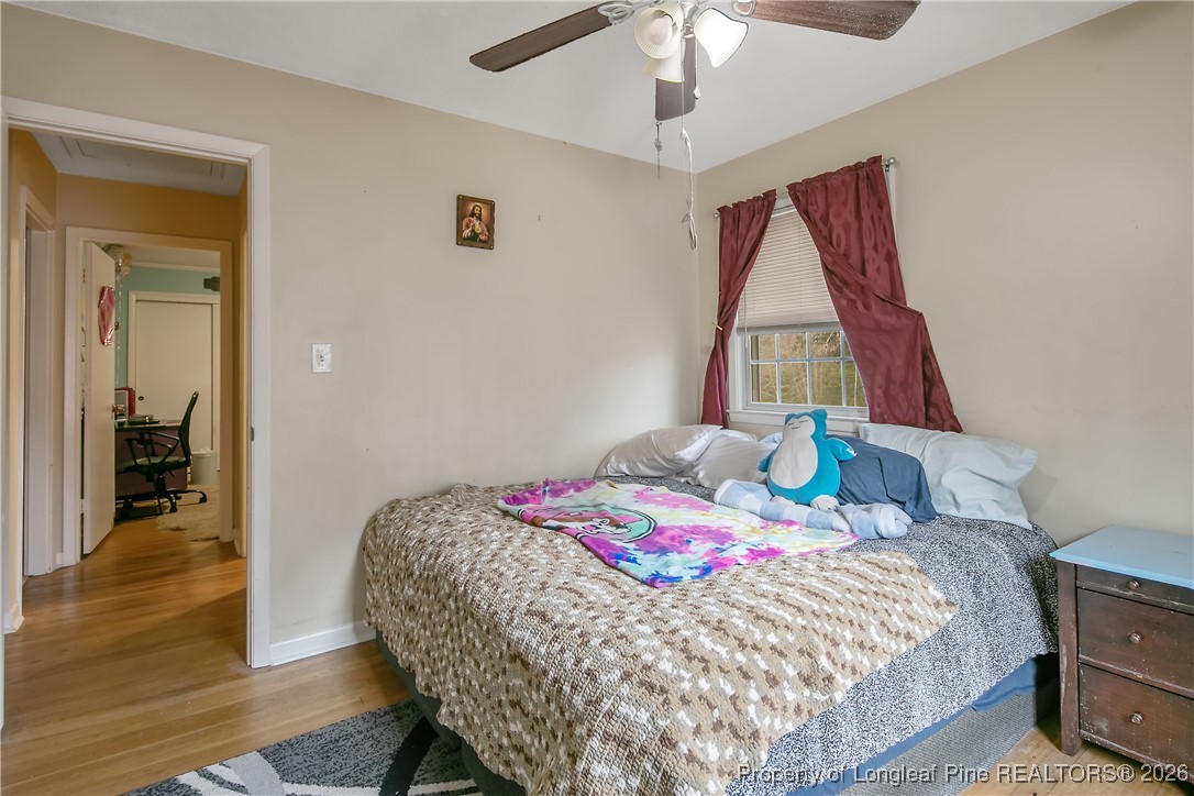 6432 Milford Road Fayetteville, NC 28303 - Photo 35 of 50 a bedroom with a bed and a window