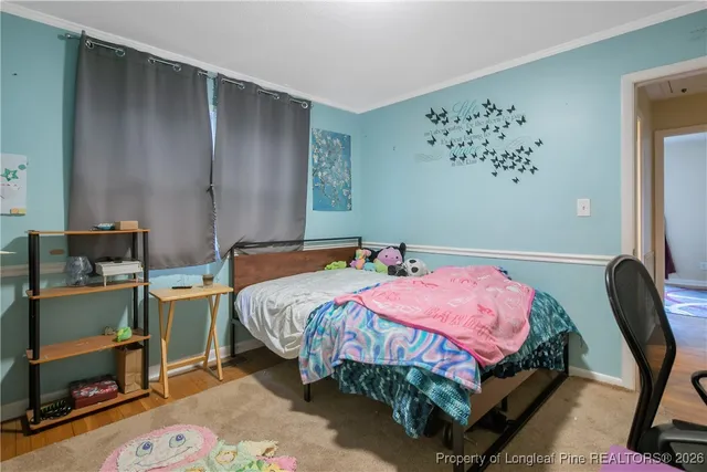 a bedroom with a bed and cabinets