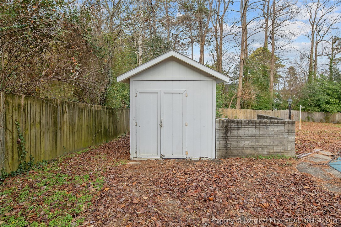 6432 Milford Road Fayetteville, NC 28303 - Photo 45 of 50 a backyard of a house with lots of green space