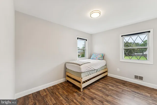 a room with a bed and window