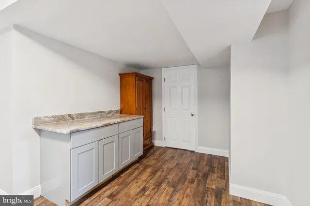 a view of a kitchen cabinets and wooden floor