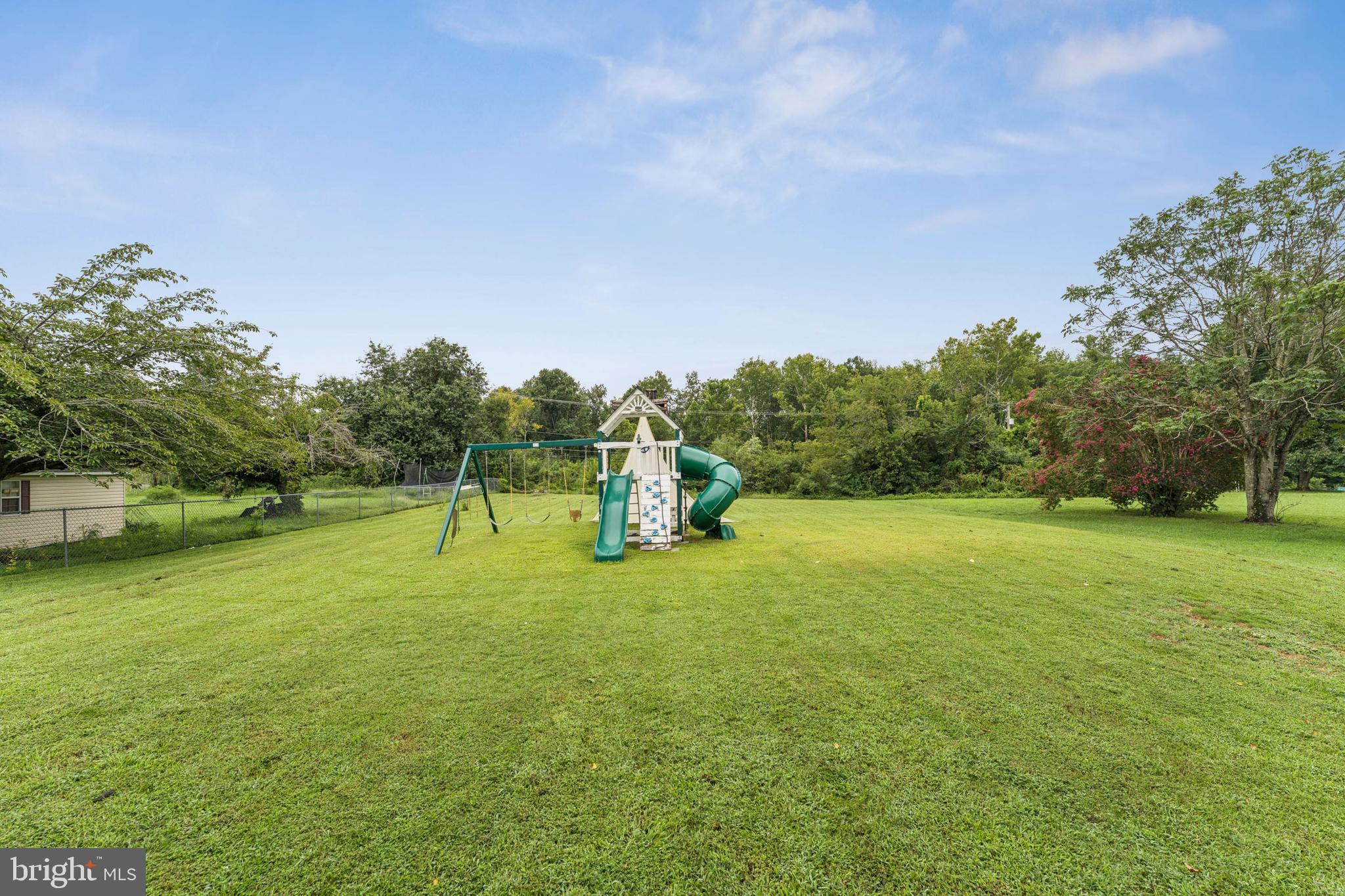 13102 Gerry Road Clinton, MD 20735 - Photo 35 of 40 a swimming pool with lots of tress in front of it
