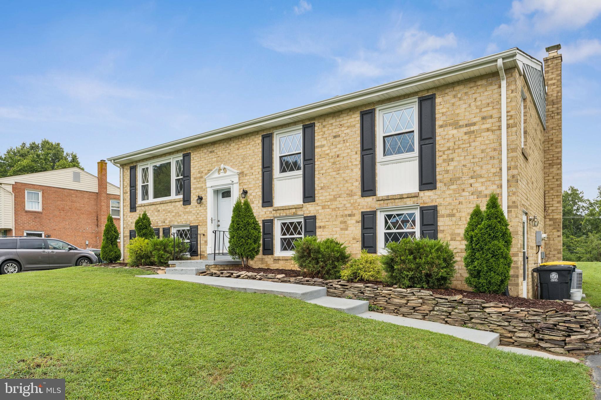 13102 Gerry Road Clinton, MD 20735 - Photo 4 of 40 a front view of a house with a yard